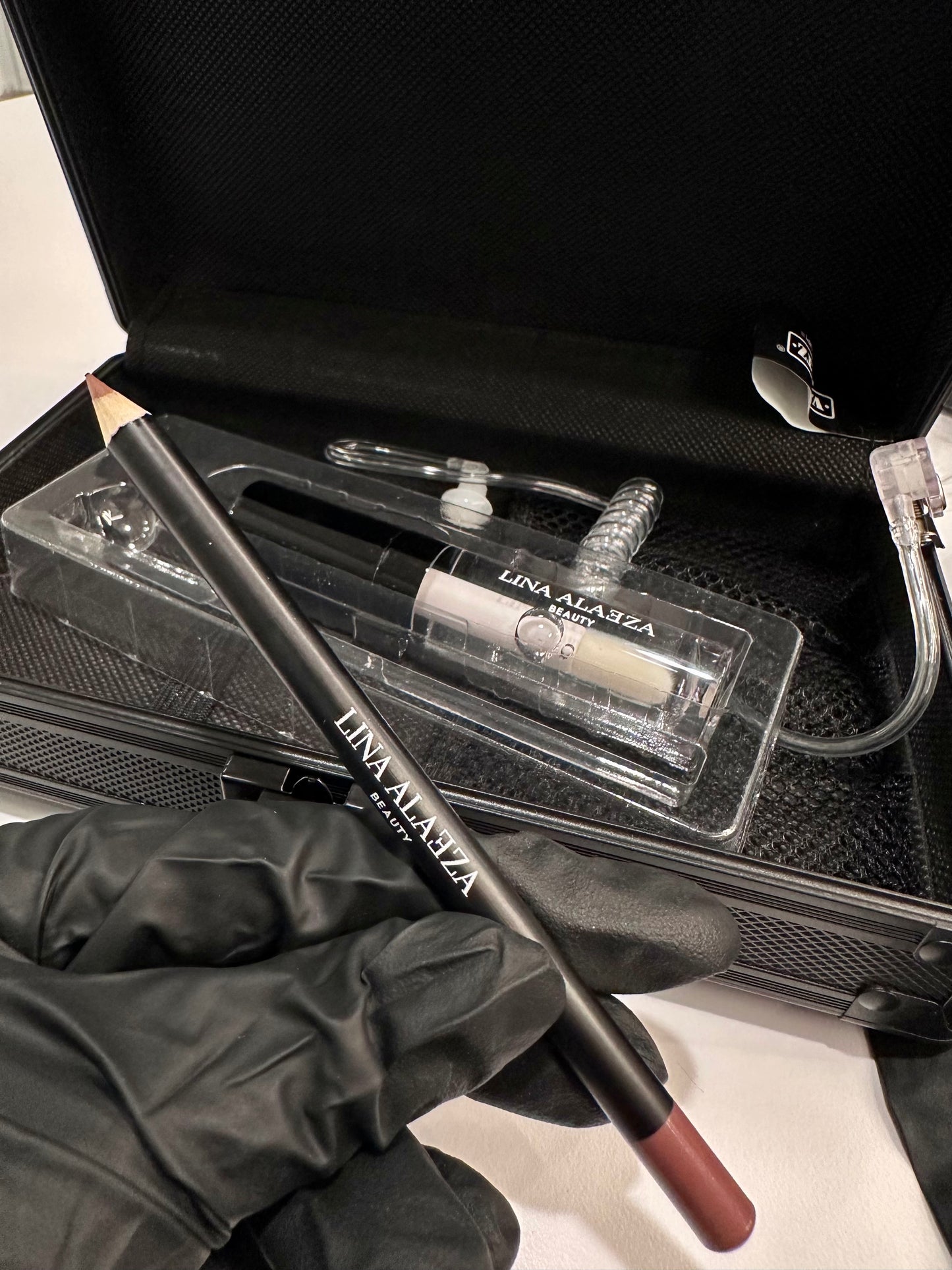 "Close up of Case Closed medium brown lipliner and gloss"